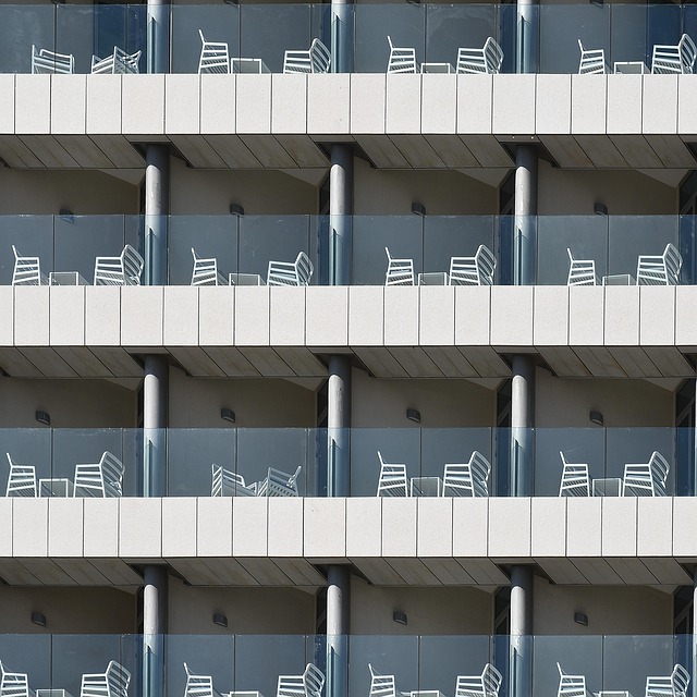 Villagers gathered around tables in a pub discussing community ownership plans